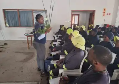 Plant-based fire safety training for firefighters in a community center.