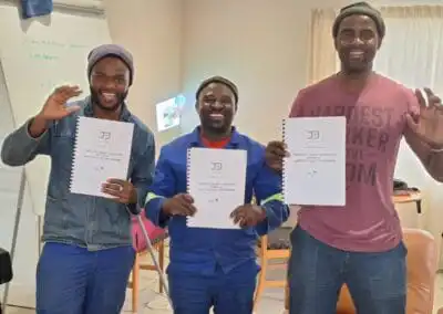 Sustainable landscape design workshop participants holding notebooks, promoting green solutions in horticulture.