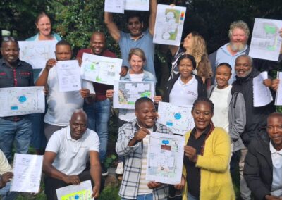 Innovative eco-friendly landscape design team holding project plans for sustainable green solutions.